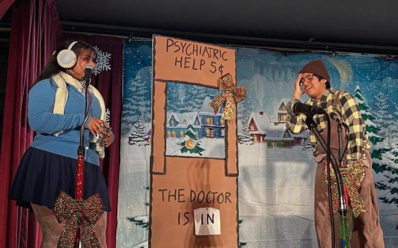 two children act onstage in winter Peanuts play